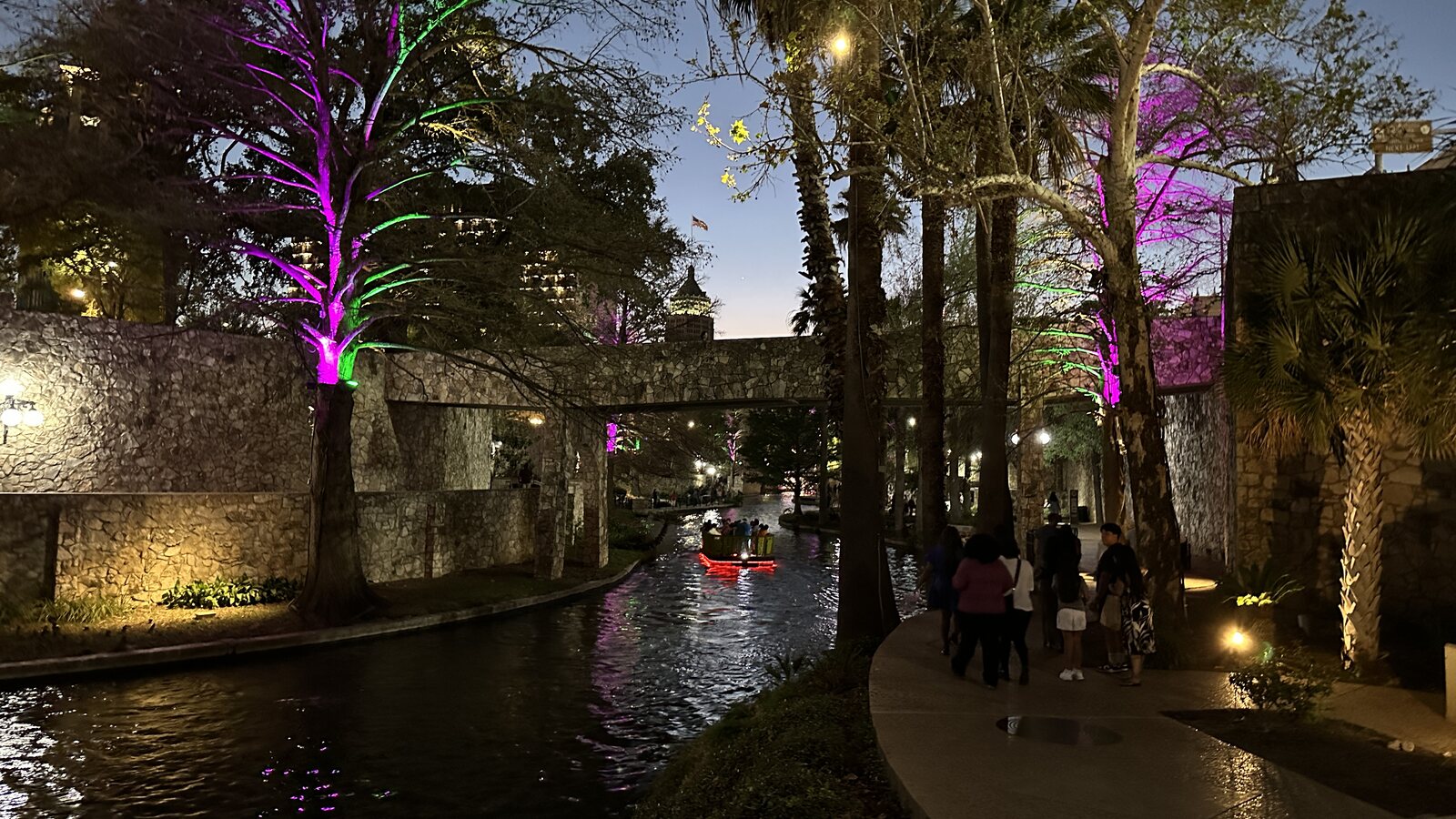 The San Antonio River Walk illuminated in the evening